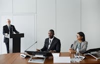 People having a Meeting in Conference Room
