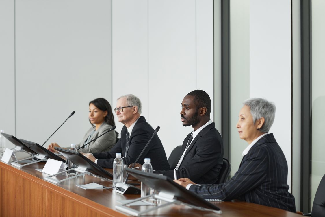 Interview panel of multiple people conducting an interview