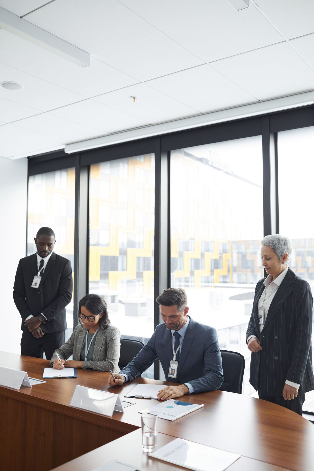 Franchise development team signing agreements