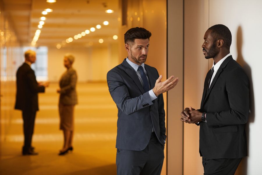 Two people mid-conversation during a working session — photo by Werner Pfennig on Pexels