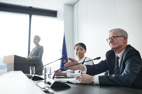 Man Speaking During an EU Conference