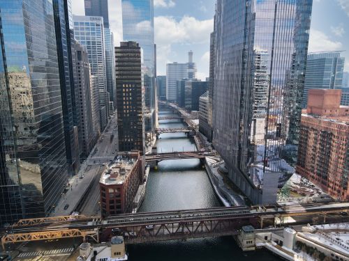Free Stunning aerial view of Chicago's urban architecture with the river winding through skyscrapers. Stock Photo