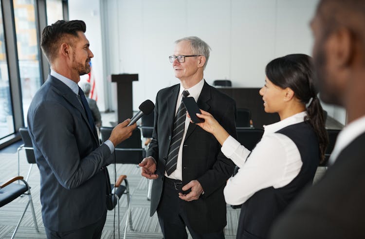 An Elderly Man Having An Interview