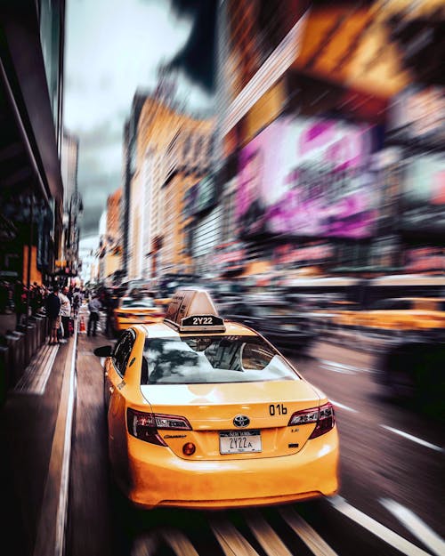 Free A Yellow Taxi Cab on the Road Stock Photo