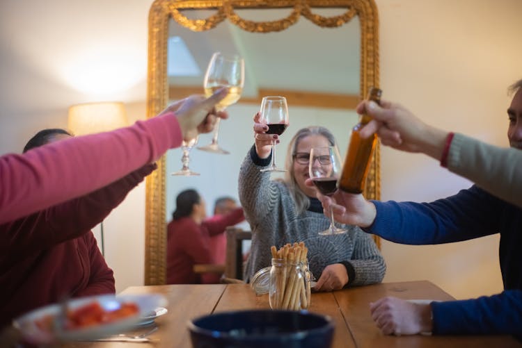 People Holding Glass Of Wine