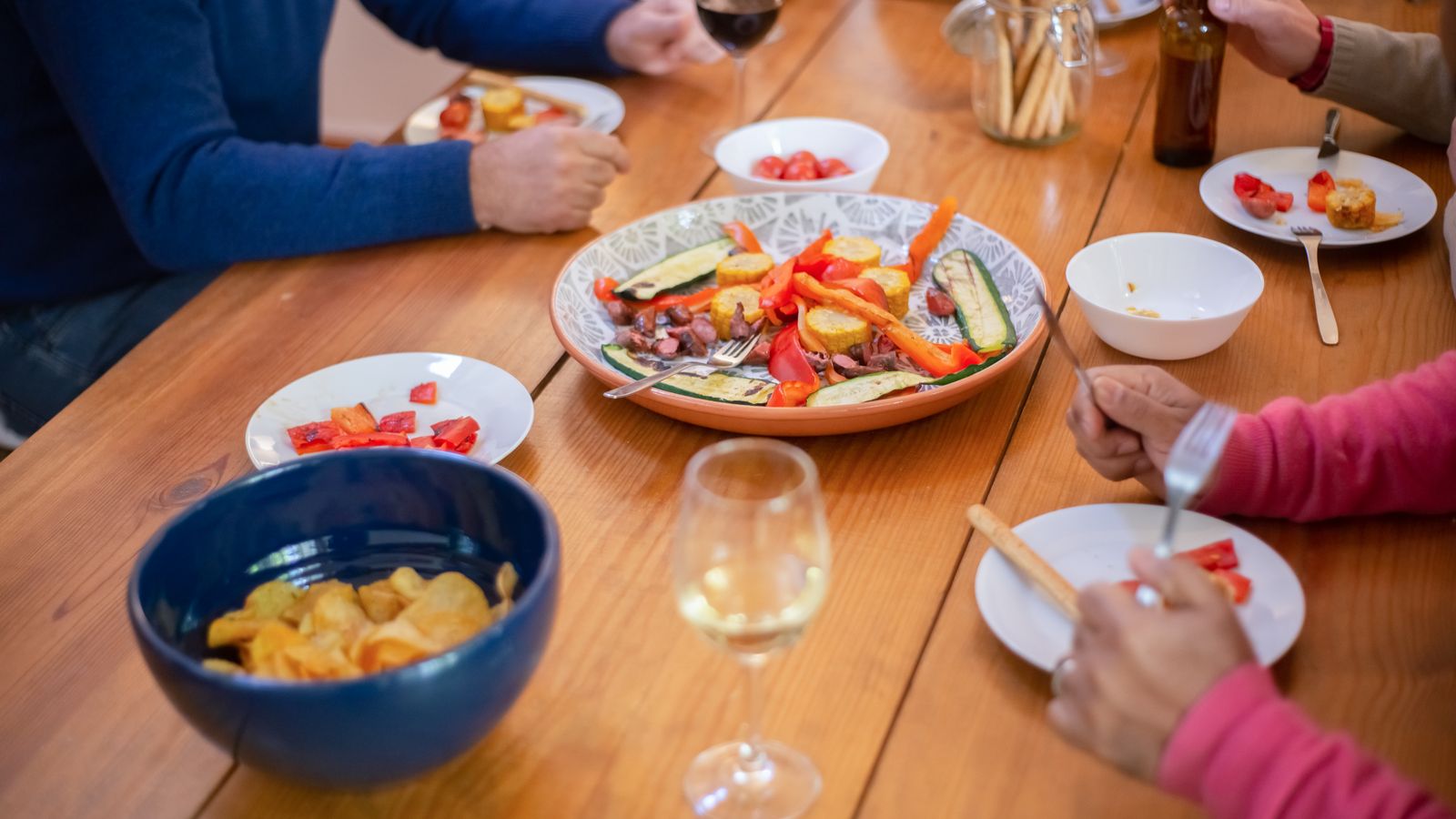 Group of people eating together, Guinea