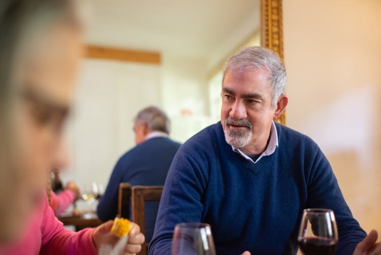 Photo Of A Man With A Goatee Wearing A Blue Sweater