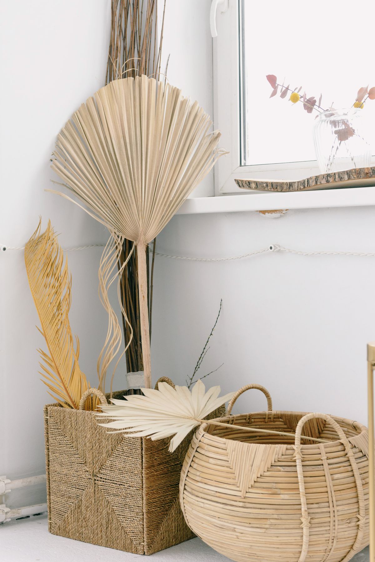 Dried palm leaves with woven baskets for natural home decor