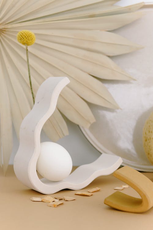 An Egg on a White Wooden Ornament