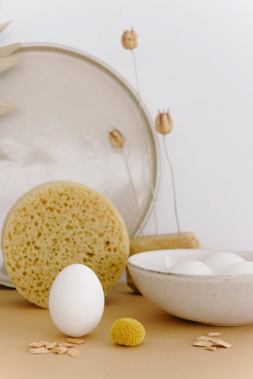 Photograph of a White Egg Near Woodchips