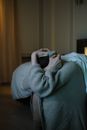 Photo of a Person Covering Her Head with Her Sweater