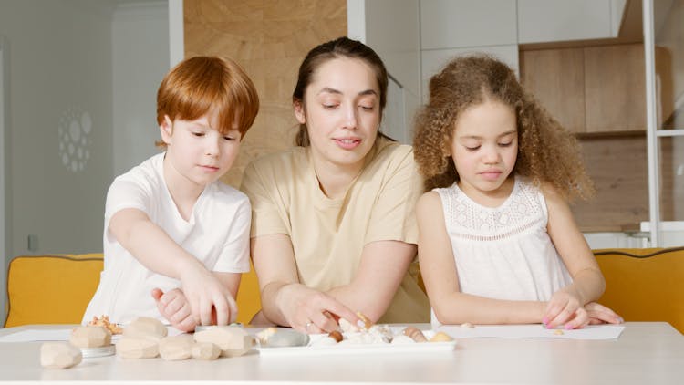 A Mother Playing With Her Children