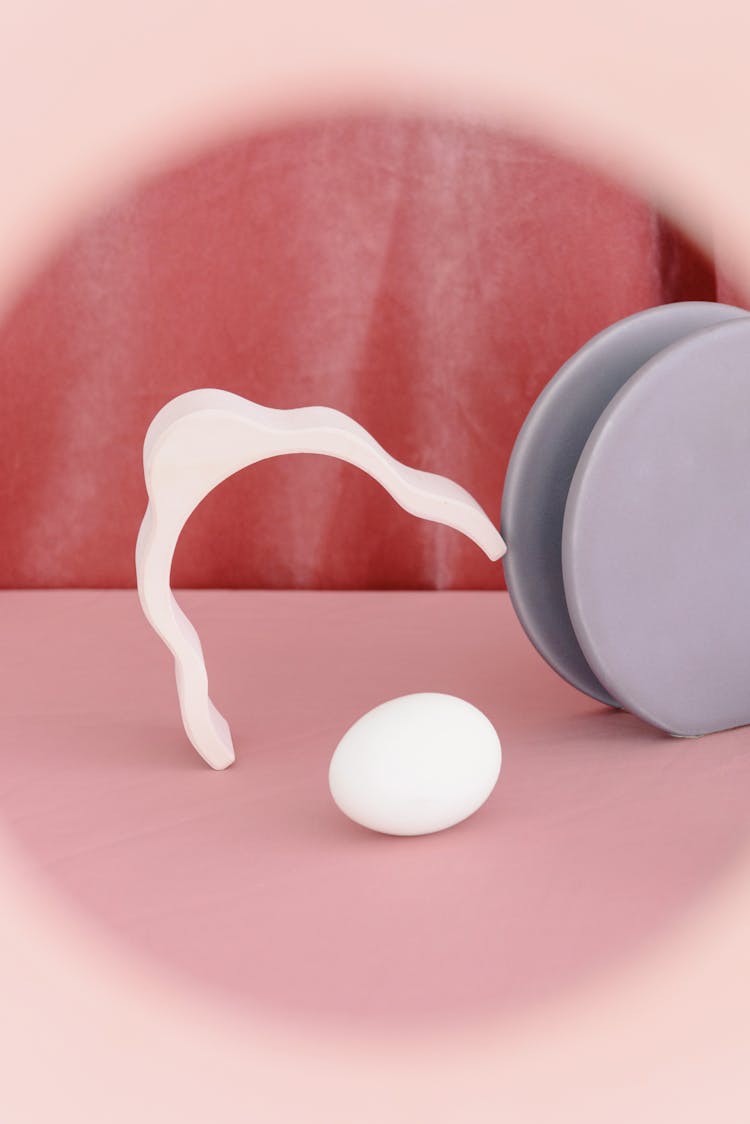 Egg Lying Between Plastic Objects