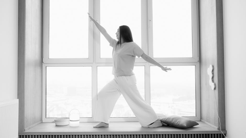 Hatch Rest vs Dohm: Nursery Noise Showdown Woman practicing yoga indoors, in a stylish black and white ambiance.