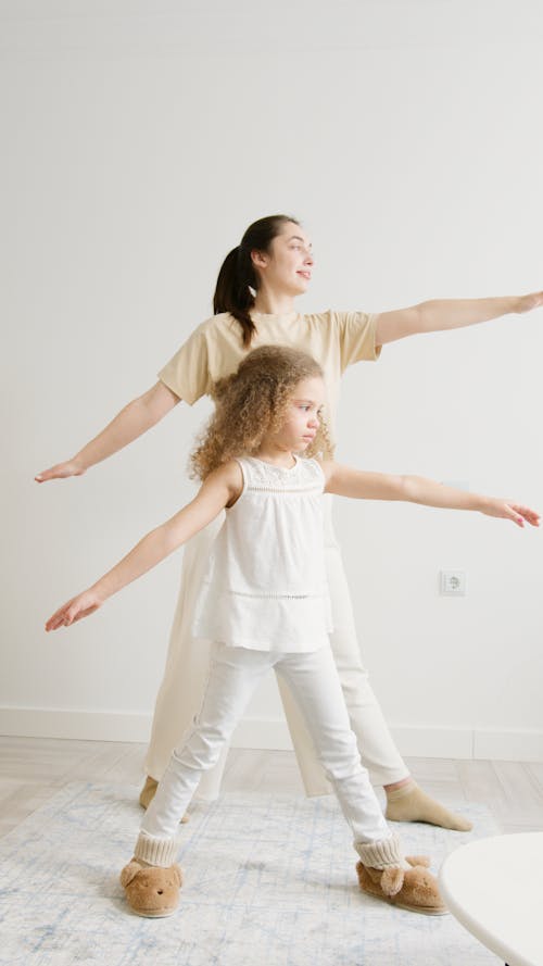 Free Mother and Daughter Doing Yoga Stock Photo
