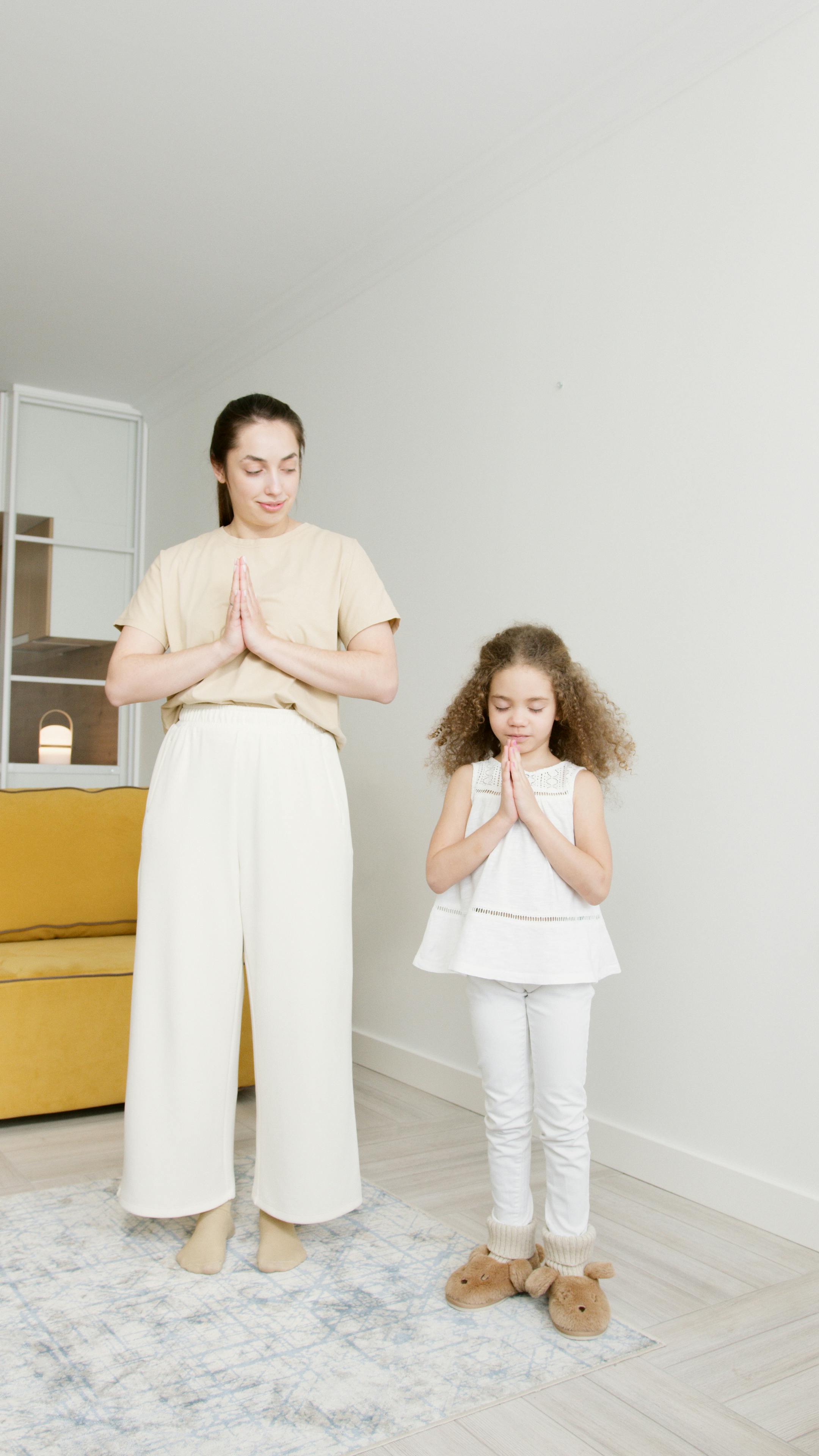 girl and a woman meditating