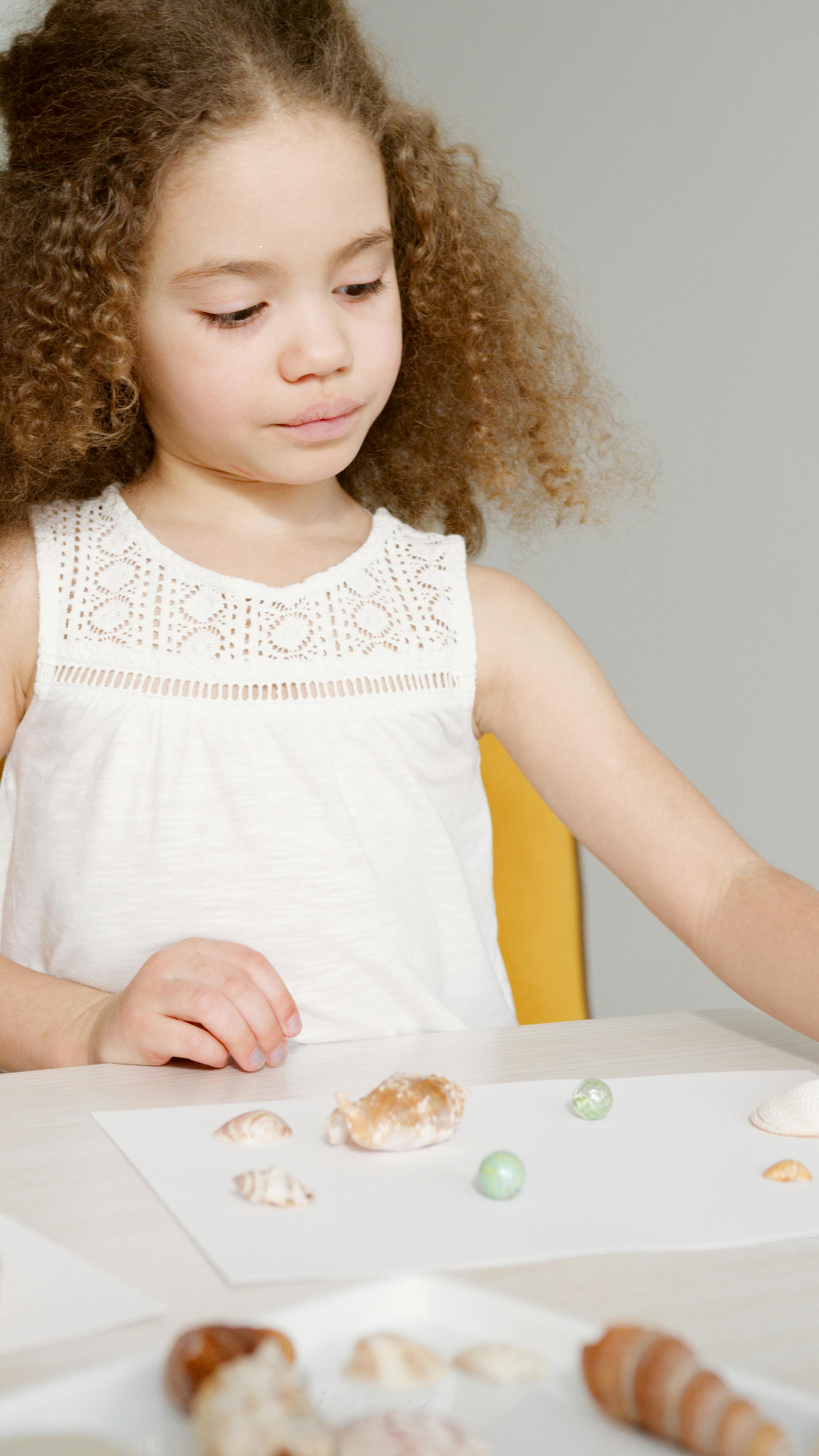 a young girl with curly hair