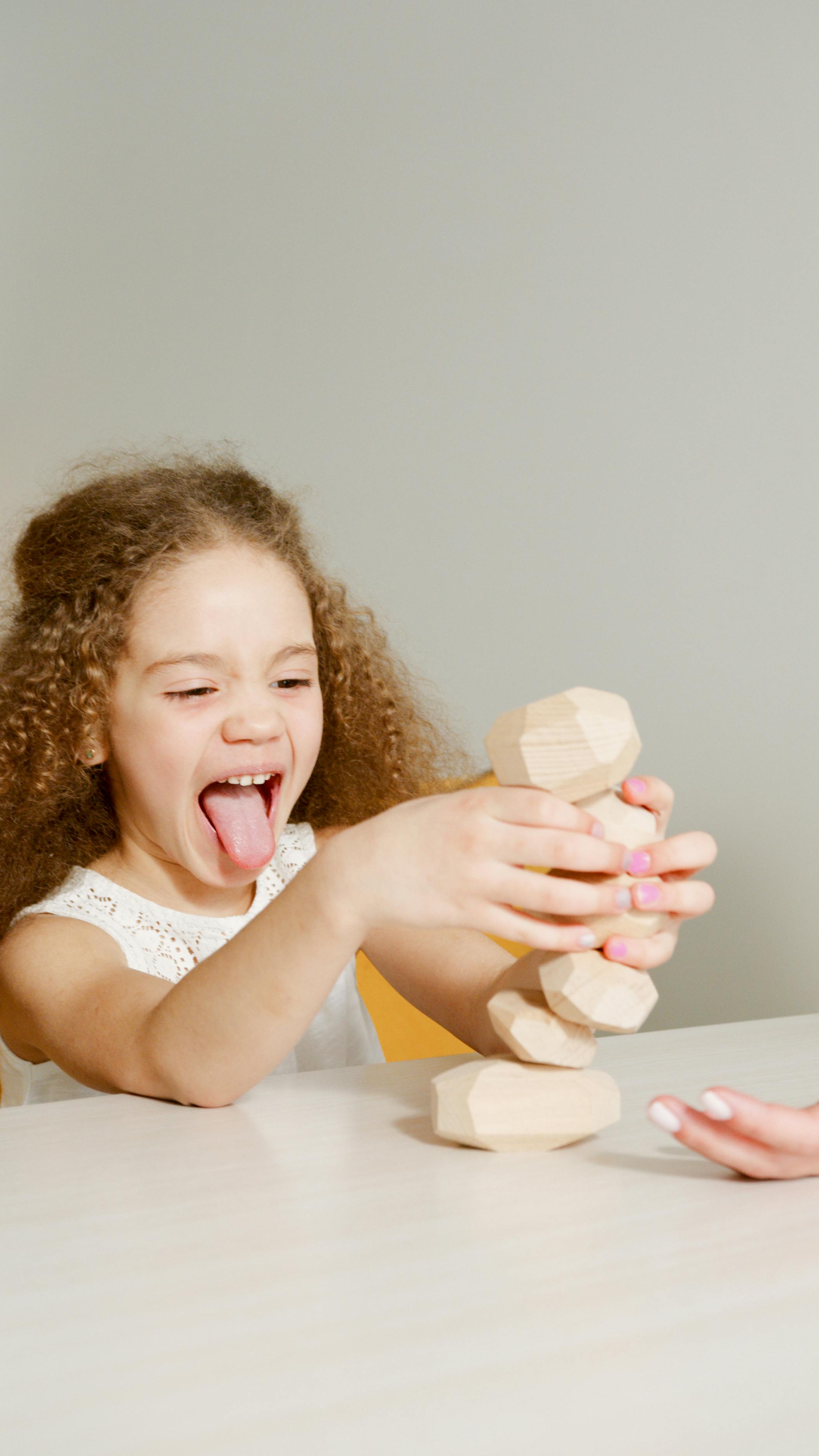 a young girl playing toys