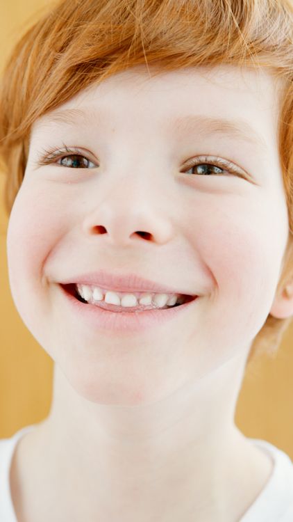 A Boy Smiling at the Camera · Free Stock Photo
