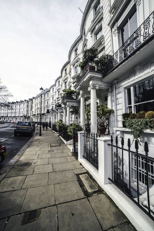 Facades of residential buildings along sidewalk