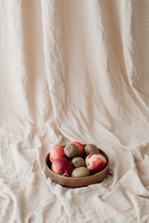 Apples and Kiwis in a Wooden Bowl 