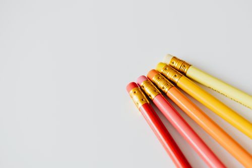 Free A set of colorful pencils with erasers arranged on a white surface. Perfect for education themes. Stock Photo