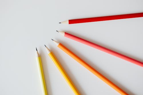 Free Colored Pencils with Different Colors on White Surface Stock Photo
