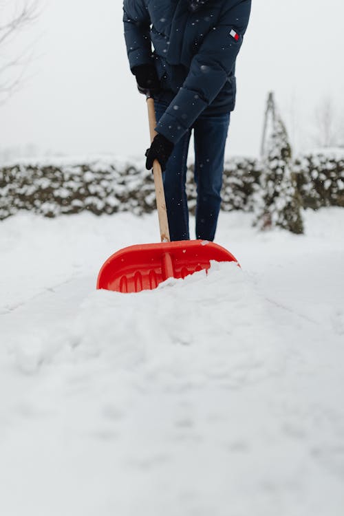 Person Clearing of Snow