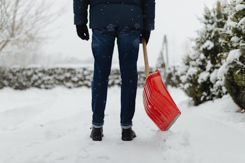 Person in Snow with Shovel