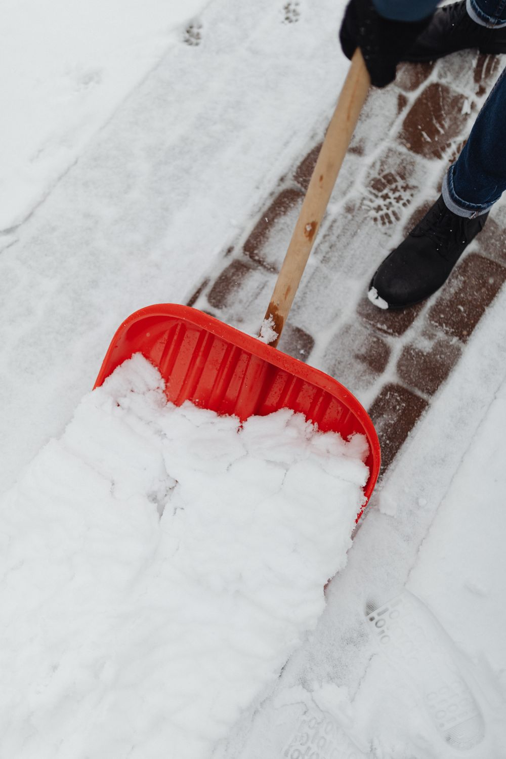 Plow clearing a driveway