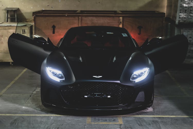 A Black Aston Martin In A Parking Lot