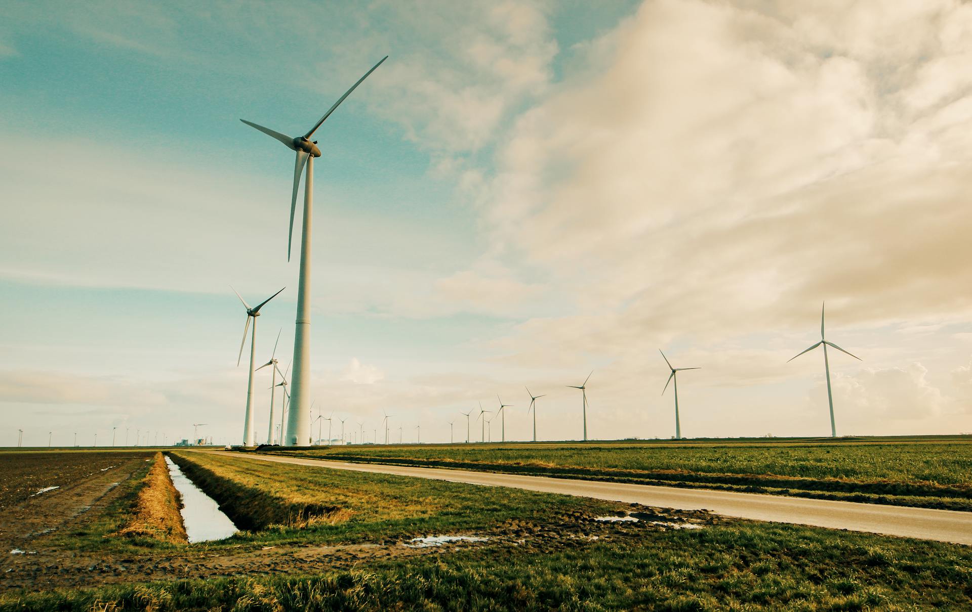 Windmill Energy on Green Grass Field