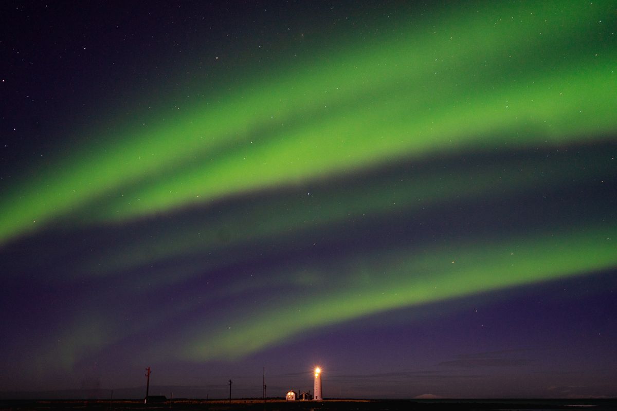 The northern lights above the Grotta lighthouse near Reykjavik