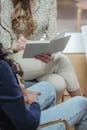 Crop unrecognizable diverse women having discussion during interview