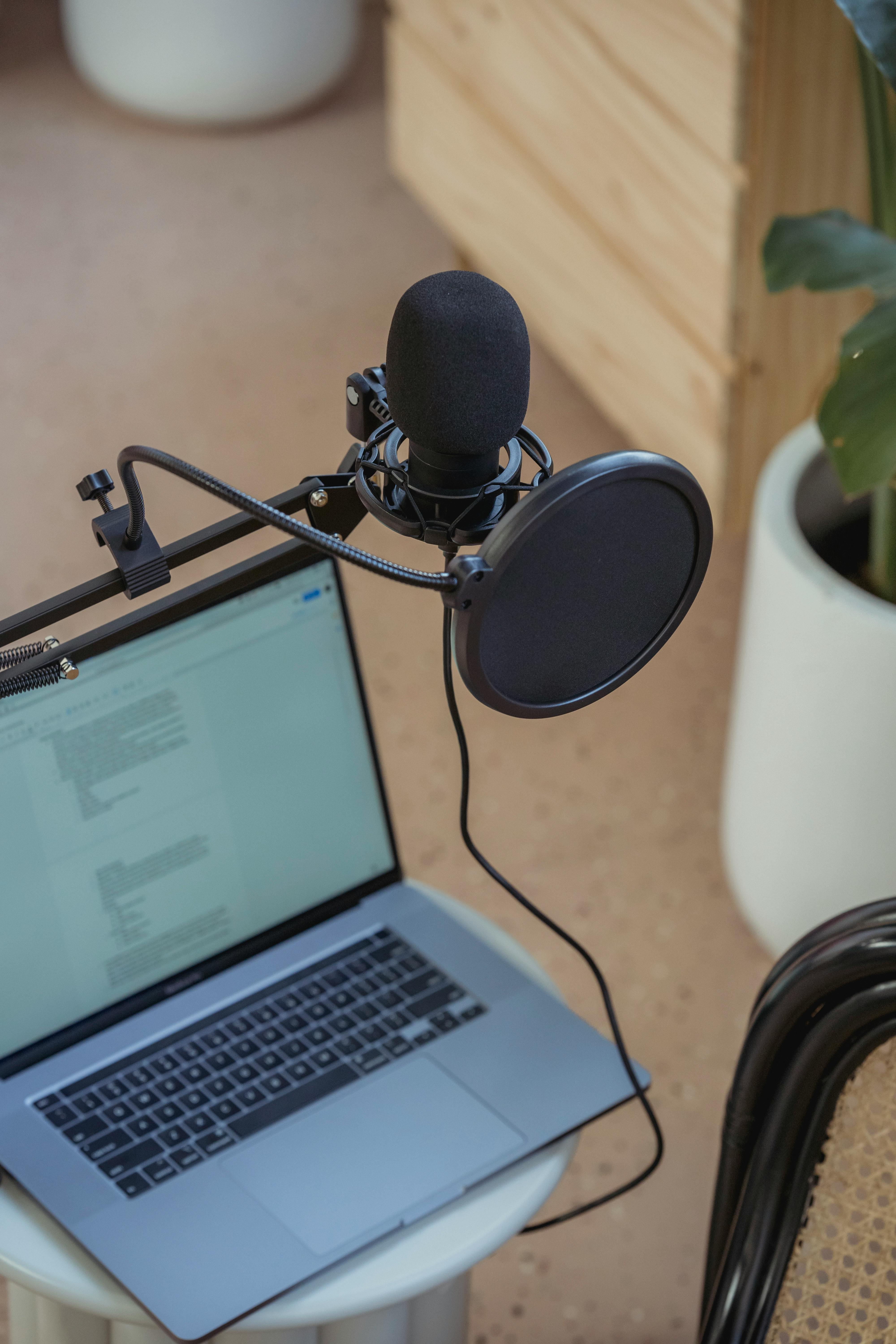 microphone on tripod attached to laptop in studio