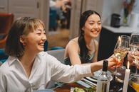 Women Raising Their Glasses For a Toast