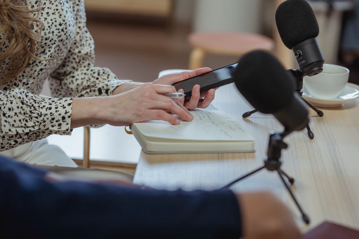 Interview with microphones and notebook