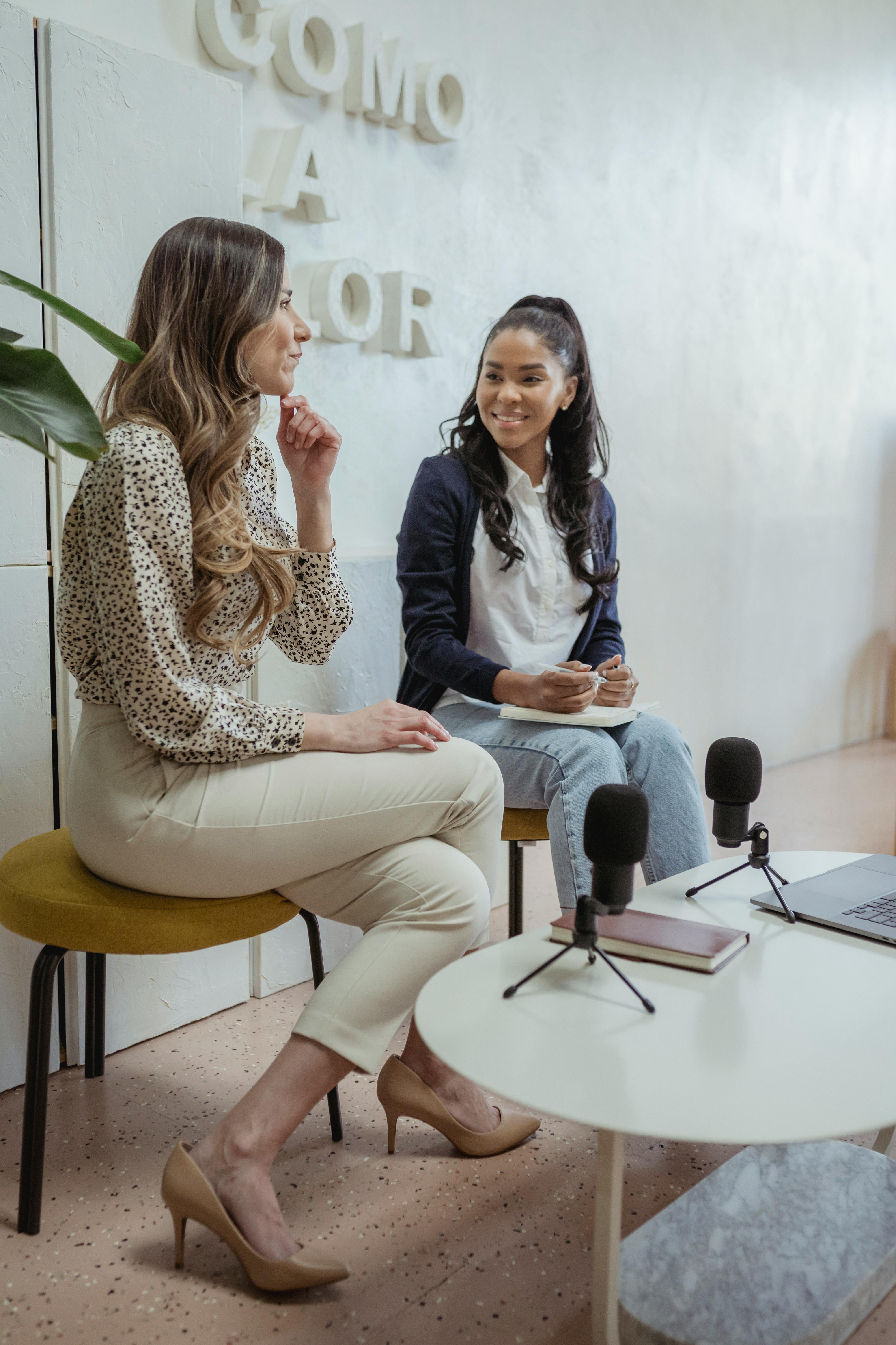 cheerful diverse women recording podcast