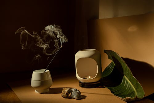 Lit Incense in a Ceramic Vase