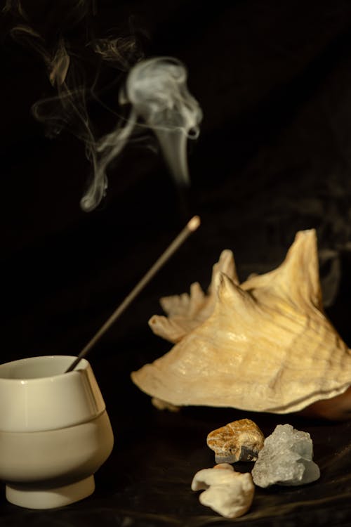 A Burning Incense in a Ceramic Vase