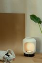 Assorted Rocks Beside a Candle Lamp