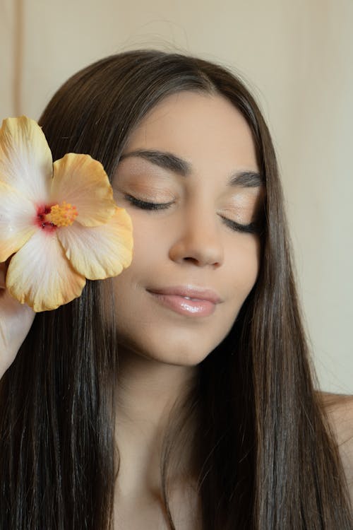 Close-up Shot of a Woman wit Her Eyes Closed