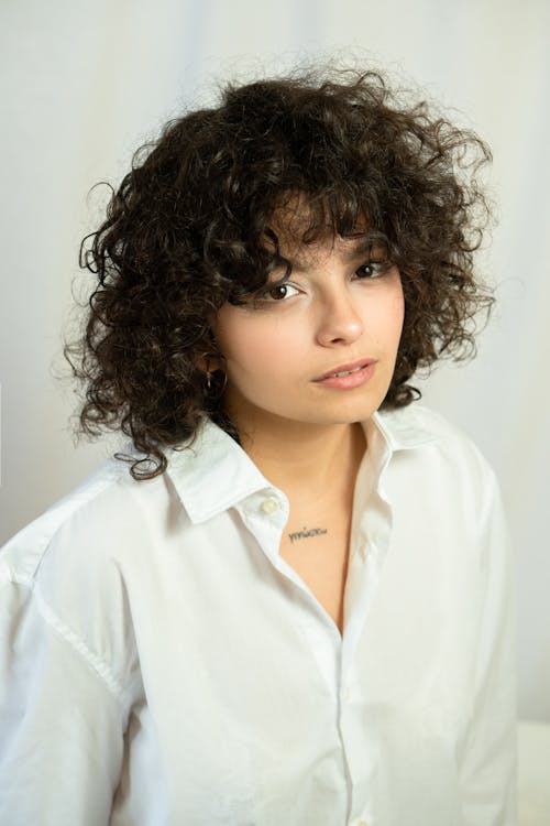 Portrait of a Woman in a White Button-Up Shirt