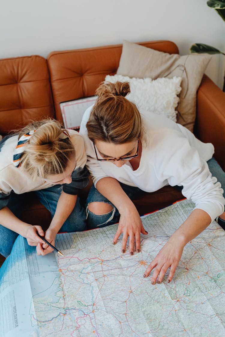 A Mother And Daughter Planning A Trip