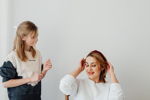 Women Standing and Sitting