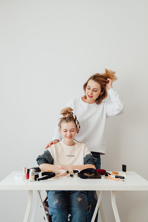 Free Woman Doing Hairstyle for Girl  Stock Photo