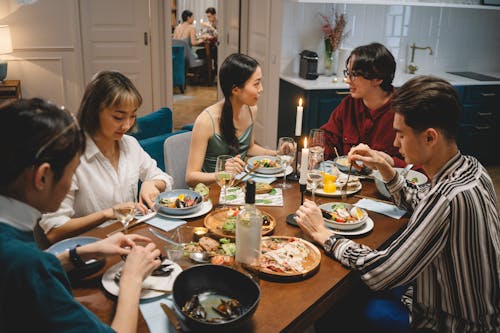 Free Friends Having a Good Conversation Over Dinner Stock Photo