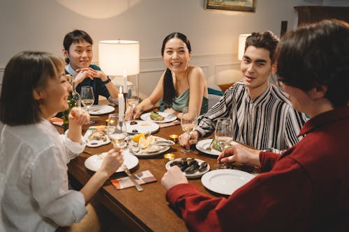 Free A Group of Friends Having a Dinner Together Stock Photo