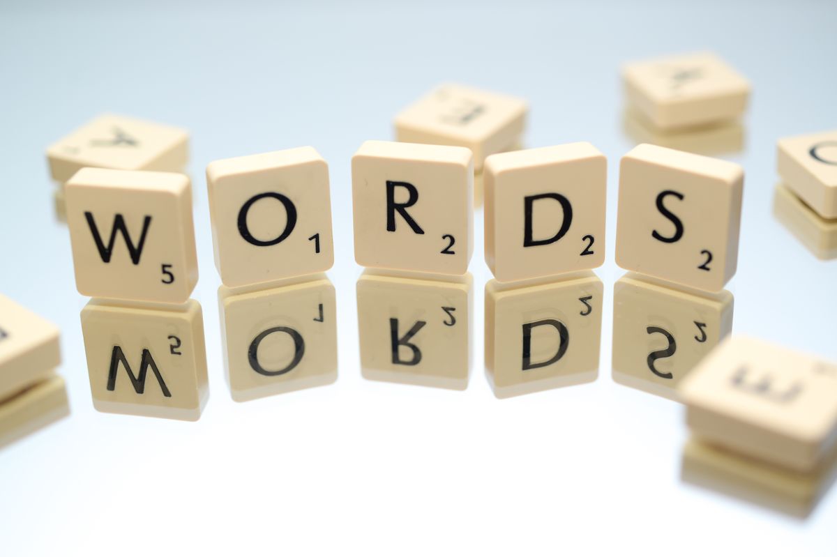 Scrabble tiles spelling the word WORDS with their point values visible