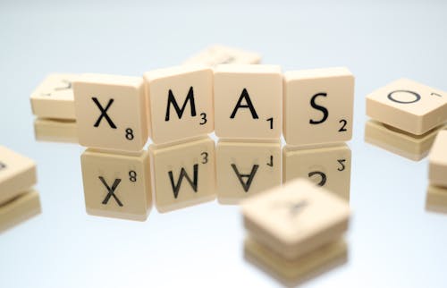 Closeup Photography of Xmas Scrabble Pieces